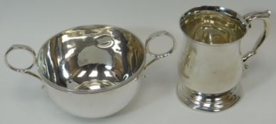 A silver twin-handled cup with twin ring handles, engraved to 'GA 1921', Sheffield 1920, Walker &