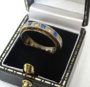 A 9ct yellow gold diamond and sapphire eternity ring, 3.38gms