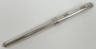 A modern silver fountain pen, marked 925 to the engraved decorated barrel