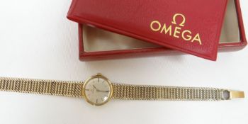 A 1969 boxed Omega ladies 9ct yellow gold wristwatch with circular white dial, 21.68gms total,