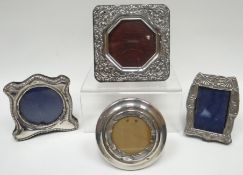 Four various silver miniature easel frames
