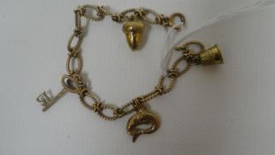 A 9ct yellow gold charm bracelet with four charms, 12.3gms