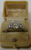 A fine antique round-cut diamond ring, the raised centre stone in a six claw setting and of an