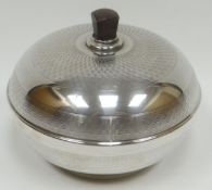 A silver powder-box bowl with machine-turned decoration and having bakelite interior and handle,