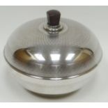 A silver powder-box bowl with machine-turned decoration and having bakelite interior and handle,