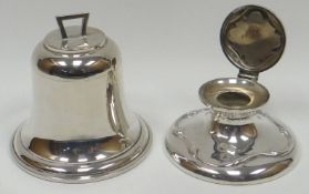 A novelty inkwell in the form a ship's bell, the hinged lid with angular handle and concealing