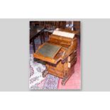 A Victorian burr walnut piano top Davenport with spring top letter rack, the curved fall opening