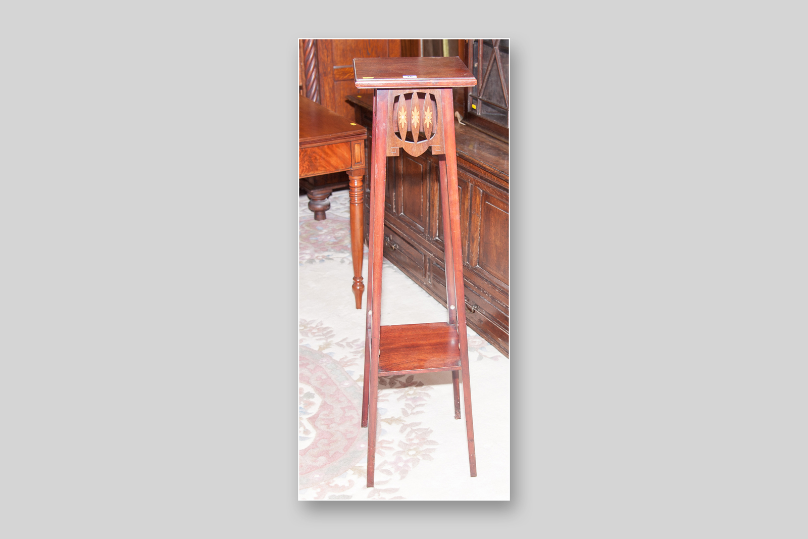 A tall mahogany two tier planter stand with floral pattern inlay to the front panel, 45 ins (114