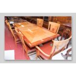 A quality modern dining table and six (four plus two) chairs, a multi-wood quarter veneered