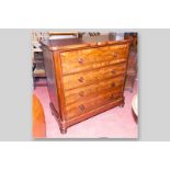 A Victorian mahogany chest of four drawers with turned wooden knobs, a top crossbanded deep drawer