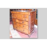 A Victorian oak Scottish chest of drawers, central hat drawer flanked by two smaller drawers