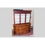 A Victorian mahogany sideboard base with curved side doors, a central bank of two short and two long