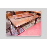 A Victorian mahogany pull-out extending table with two extra leaves, moulded edge round cornered