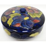 A blue ground Moorcroft tube-lined floral powder-bowl and cover, 5.5ins diam (14cms)