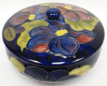 A blue ground Moorcroft tube-lined floral powder-bowl and cover, 5.5ins diam (14cms)