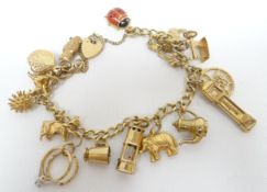 A 9ct yellow gold charm bracelet with mixed yellow metal and 9ct charms, 26.45gms total