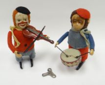 Two Schuco clockwork felt-covered figures in the form of a drumming monkey and a fiddler clown (