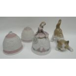 A Lladro playful kitten, two Lladro Christmas bells and a Lladro figural-bell