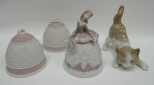 A Lladro playful kitten, two Lladro Christmas bells and a Lladro figural-bell