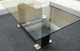 A 'Monaco' heavy quality Italian-made contemporary glass top dining-table raised upon a centre stile