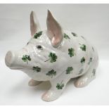 A large Wemyss 'Shamrock' patterned seated pig, forward facing while raised upon front trotters with