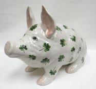 A large Wemyss 'Shamrock' patterned seated pig, forward facing while raised upon front trotters with