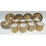 Eight Royal Crown Derby Imari coffee-cans and saucers