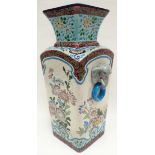 A Longwy faience-ware square-based vase of tapering form and with flared chimney neck, profusely