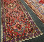 A hand-woven Persian Heriz runner-carpet, 37.5 x 109.5ins (96 x 278cms)