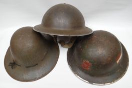 A WWII 'Welch Regiment' tommy-helmet with liner and bearing applied red Prince of Wales regimental