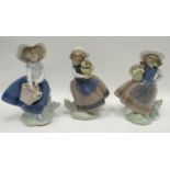 Three Lladro flower picking girl figures