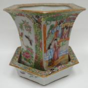 A nineteenth century Canton famille-rose hexagonal planter and matching dish, typically decorated