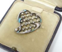 An Asprey of London heart-shaped enamelled brooch, the interior with a grid of seed pearls and