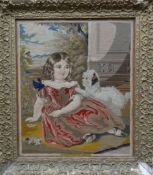 A nineteenth century pictorial tapestry of a reclining girl and puppy, in a decorative gilt gesso