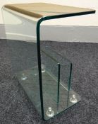 A contemporary 'folded' glass Canterbury on chrome supports, 19.75ins wide (50cms)
