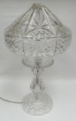 A mid-twentieth century cut-glass mushroom-shaped table lamp with pointed shade, 19ins high (48cms)