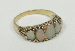A yellow gold antique ring (marks unclear) set with a row of five oval opals, 4.24gms