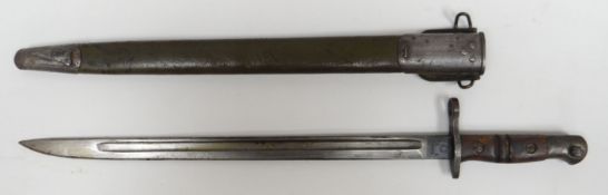 A British military 1913 Remington bayonet and scabbard with wooden handle, 22.5ins long (57cms)