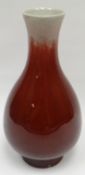 A Sang de Boeuf crackle-glazed narrow necked vase, 9ins high (23cms)