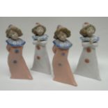 Two pairs of Nao standing clown figures