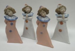 Two pairs of Nao standing clown figures