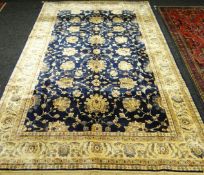 A blue ground Kashmir rug, 76 x 116ins (193 x 296cms)