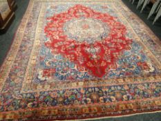 A splendid hand-woven Persian Sarouk carpet with shaped medallion design, 113 x 149ins (286 x