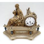 A figural gilt-metal mantel-clock composed of a seated Classical lady beside the drum timepiece, all