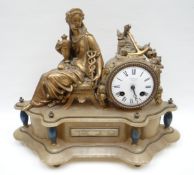 A figural gilt-metal mantel-clock composed of a seated Classical lady beside the drum timepiece, all