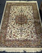 An ivory ground hand-woven Kashmir rug, 66 x 42ins (158 x 107cms)