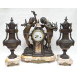 A French spelter and pink marble clock garniture. With two dancing cherubs flanking the raised