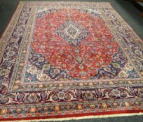 A splendid Persian hand-woven carpet with all-over medallion design, 114 x 180ins (290 x 380cms)