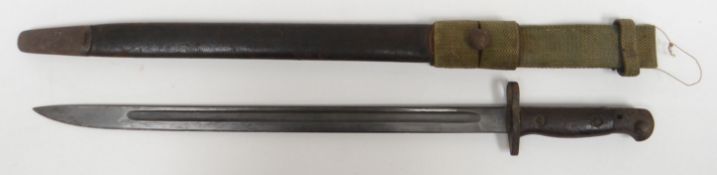 A British military 1907 bayonet and scabbard with wooden handle and canvas belt attachment, 22.