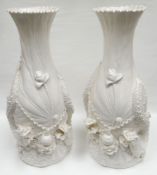 A pair of Republican period Chinese 'blanc de chine' baluster vases, decorated naturalistically